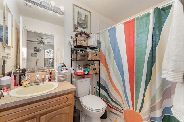 bathroom with ceiling fan, vanity, and toilet