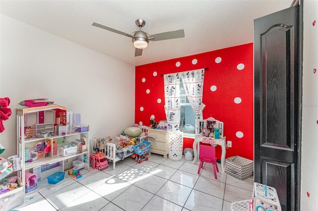 recreation room featuring ceiling fan and light tile patterned flooring