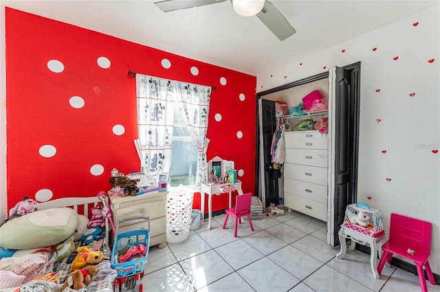 rec room featuring ceiling fan and tile patterned flooring