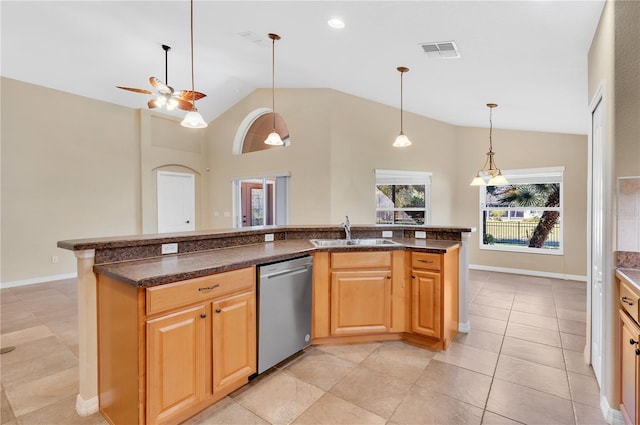 kitchen with sink, hanging light fixtures, light tile patterned floors, stainless steel dishwasher, and ceiling fan