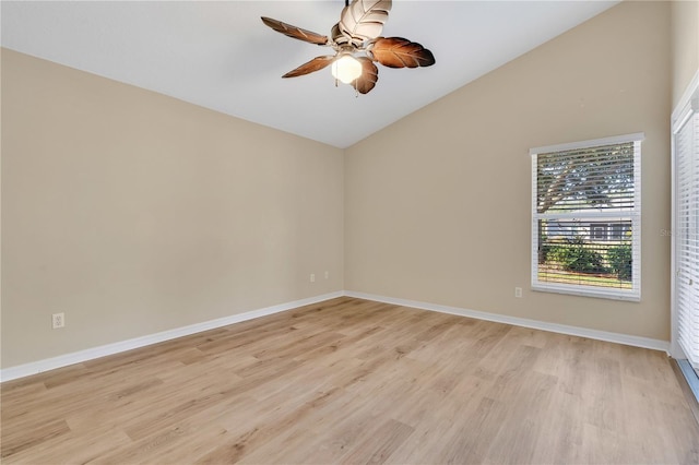 unfurnished room with lofted ceiling, ceiling fan, and light wood-type flooring