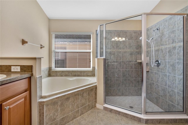 bathroom with vanity, plus walk in shower, and tile patterned flooring