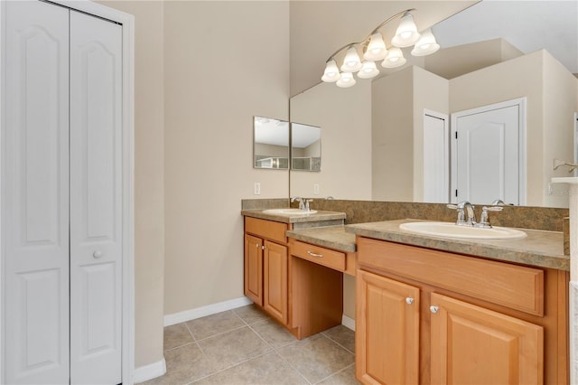 bathroom with tile patterned flooring and vanity