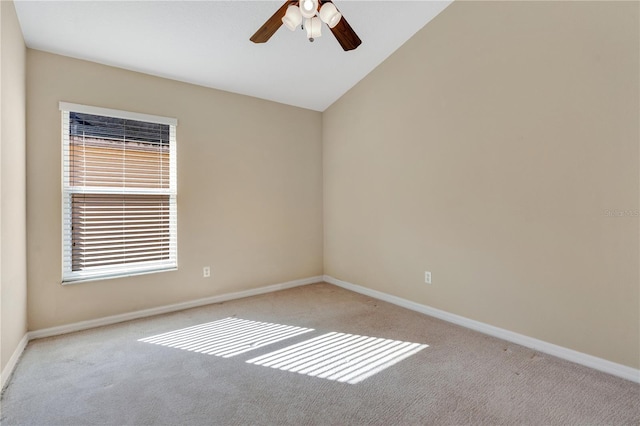 carpeted empty room with lofted ceiling and ceiling fan