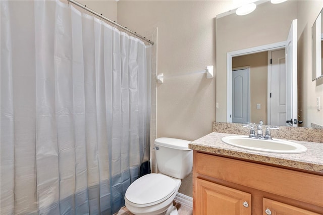 full bathroom featuring vanity, shower / tub combo, and toilet