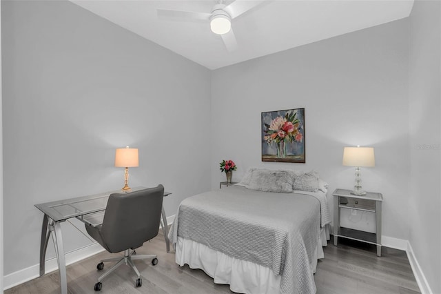 bedroom featuring hardwood / wood-style flooring and ceiling fan