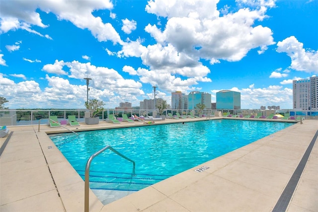 view of swimming pool featuring a patio area