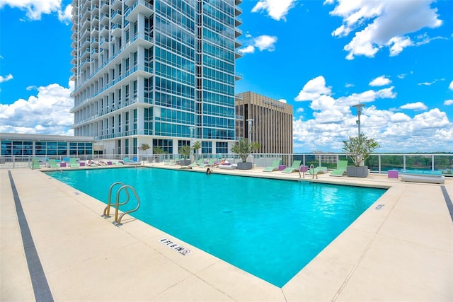 view of swimming pool with a patio area