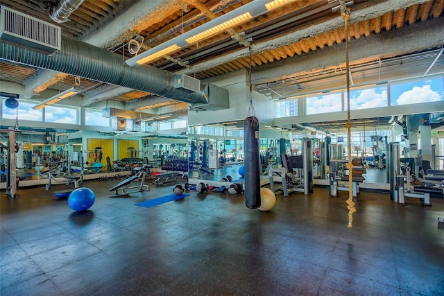 workout area with a high ceiling