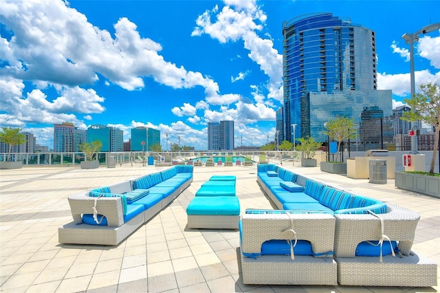 view of pool featuring an outdoor living space and a patio area