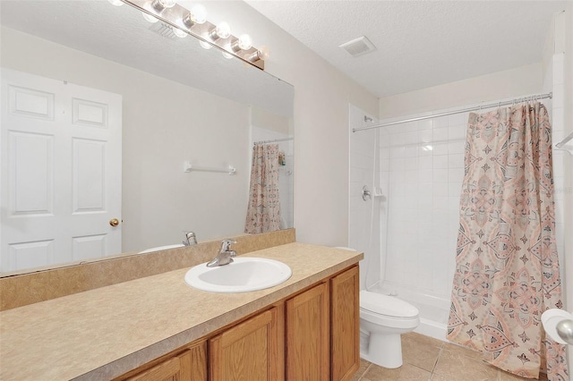 bathroom featuring tile patterned flooring, vanity, toilet, a textured ceiling, and a shower with shower curtain