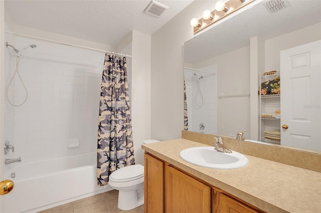 full bathroom featuring tile patterned floors, toilet, shower / tub combo, a textured ceiling, and vanity