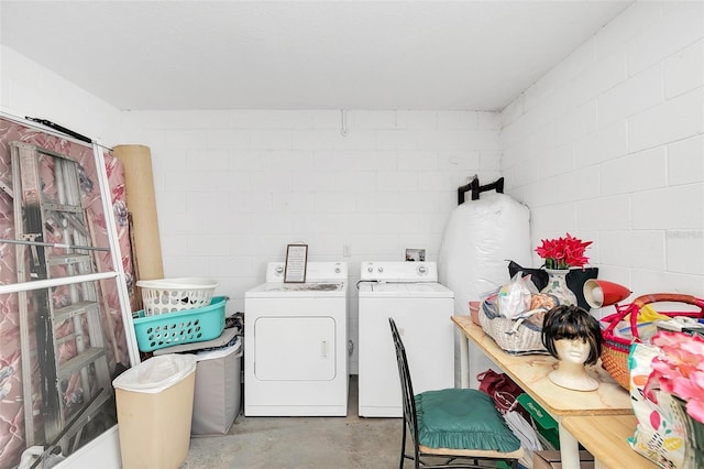 clothes washing area featuring washing machine and dryer