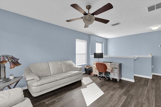 office with ceiling fan, dark hardwood / wood-style floors, and a textured ceiling