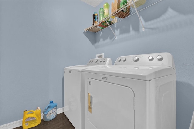 laundry area featuring separate washer and dryer and dark hardwood / wood-style floors