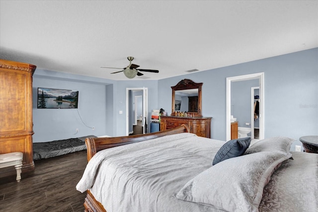 bedroom with dark hardwood / wood-style floors and ceiling fan