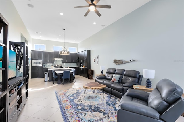 tiled living room with ceiling fan