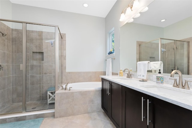 bathroom featuring vanity and separate shower and tub