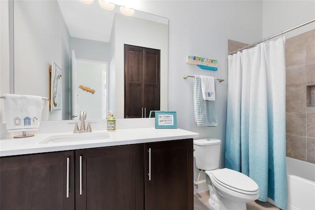 full bathroom featuring vanity, shower / bathtub combination with curtain, and toilet