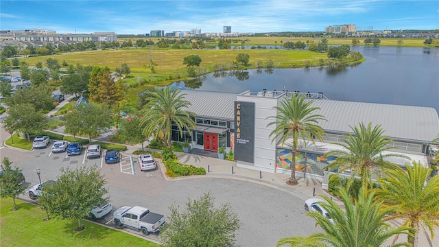 birds eye view of property with a water view