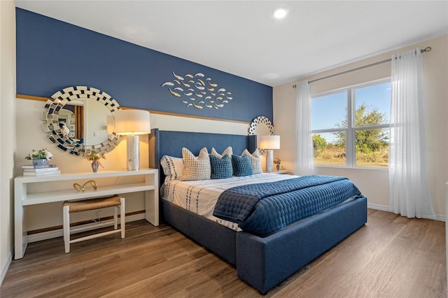 bedroom with wood-type flooring