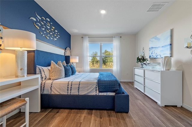 bedroom featuring wood-type flooring