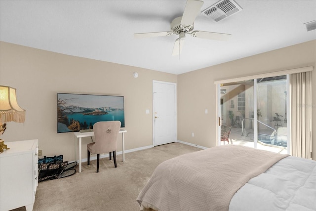 bedroom with multiple windows, access to exterior, light colored carpet, and ceiling fan