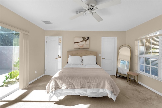 bedroom with light carpet, access to exterior, and ceiling fan