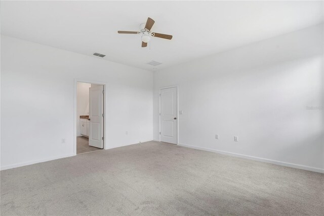 unfurnished room featuring light colored carpet and ceiling fan