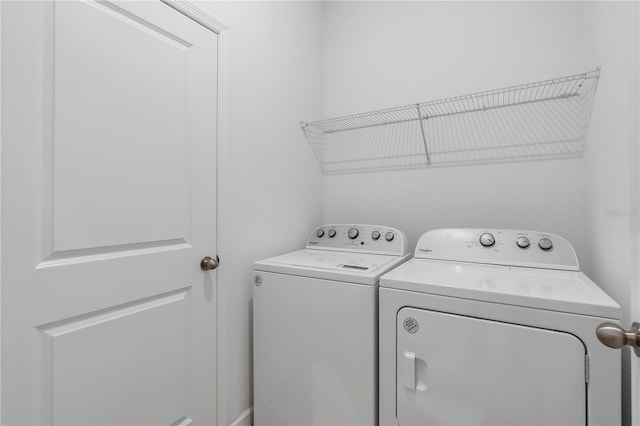 laundry room with washer and clothes dryer