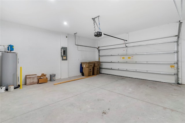 garage with a garage door opener, electric panel, and water heater