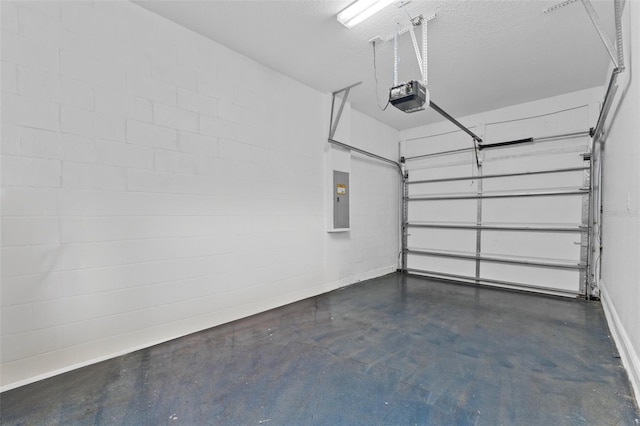 garage with a garage door opener and electric panel