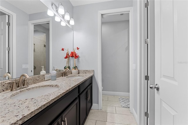 bathroom featuring vanity, toilet, and tile patterned flooring