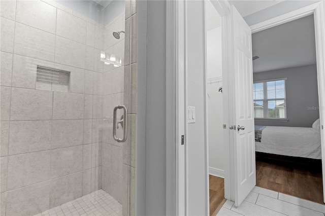 bathroom featuring tile patterned floors and walk in shower