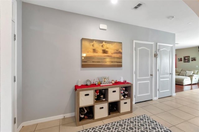 game room with light tile patterned flooring