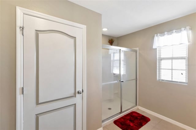 bathroom with a shower with shower door