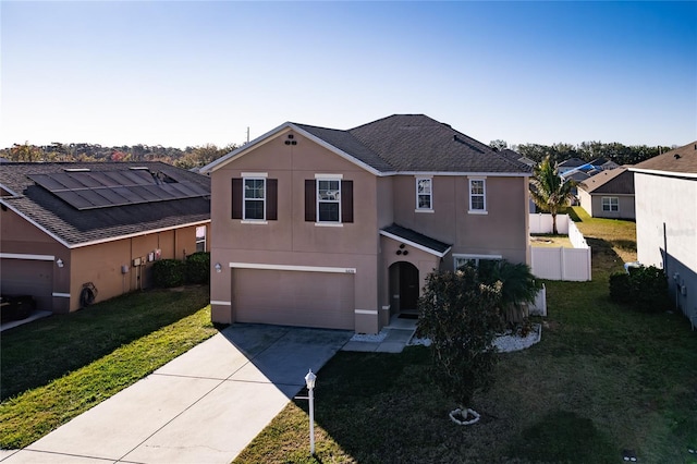 view of front property with a garage and a front lawn