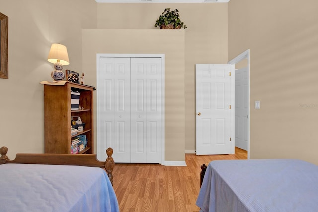 bedroom featuring a closet and light wood-type flooring