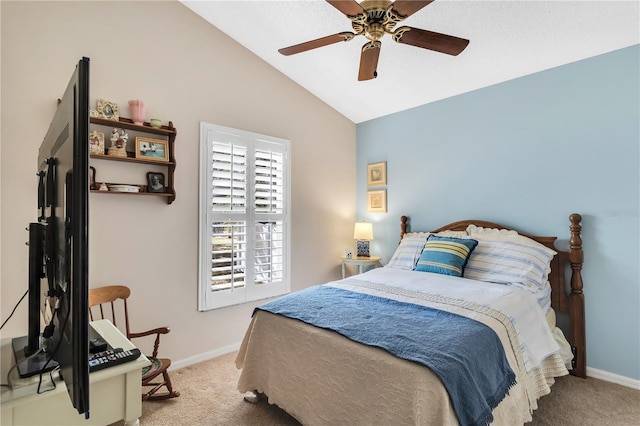 bedroom with vaulted ceiling, light carpet, and ceiling fan