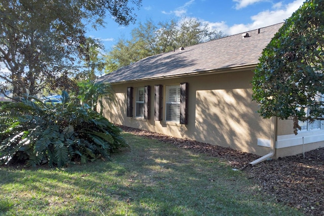 view of home's exterior featuring a yard