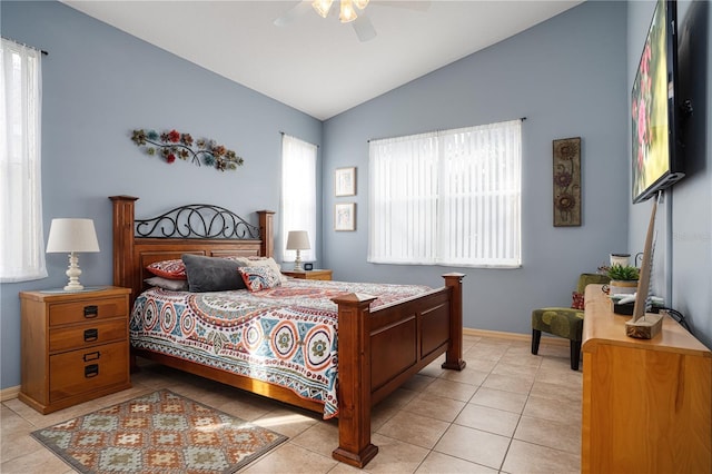 tiled bedroom with ceiling fan and vaulted ceiling