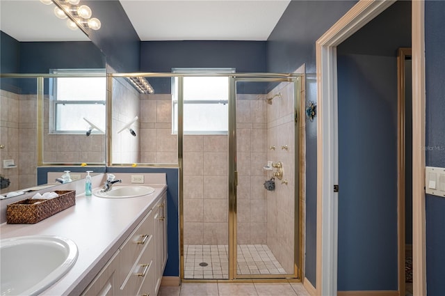 bathroom with vanity, tile patterned floors, and a shower with shower door