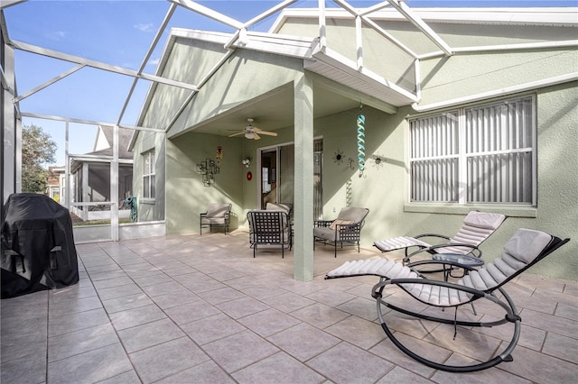 view of patio with ceiling fan, a lanai, and area for grilling