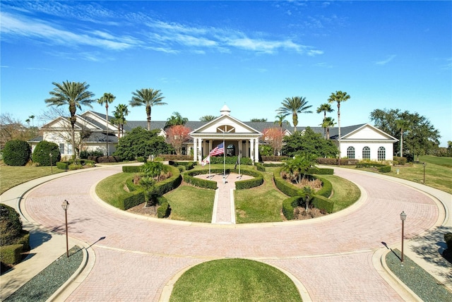 view of property's community with a lawn