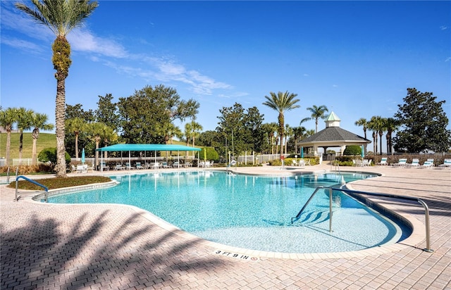 view of pool featuring a gazebo and a patio