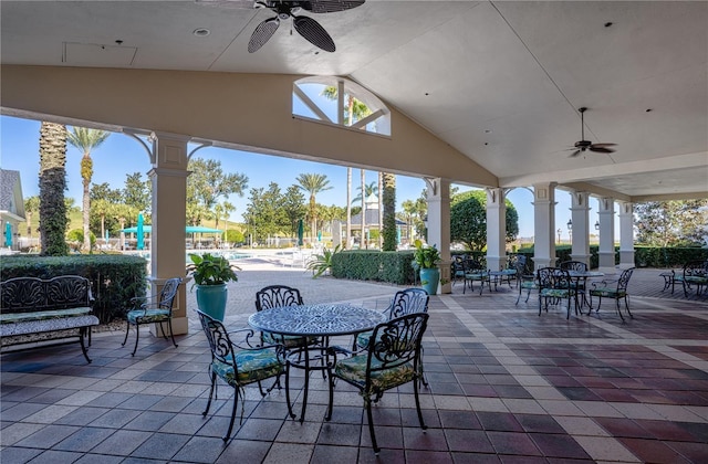 view of patio featuring ceiling fan and a playground