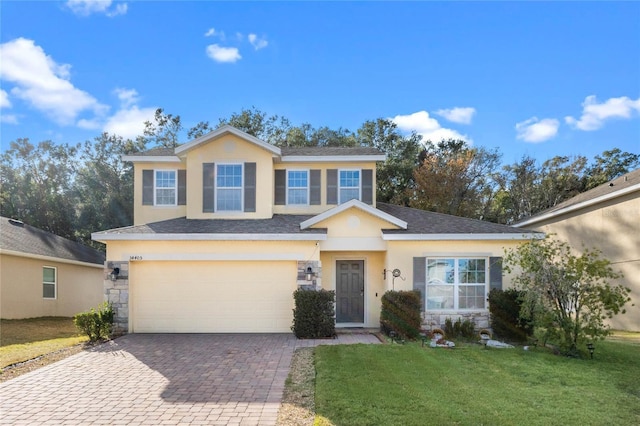 view of front facade with a garage and a front yard