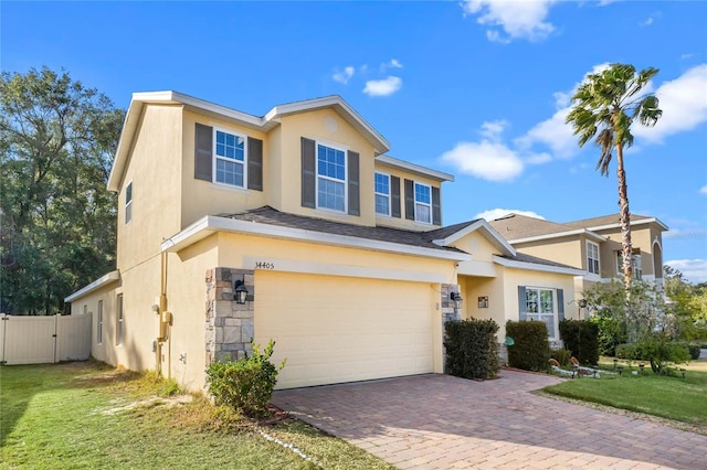 view of front of home with a garage and a front yard