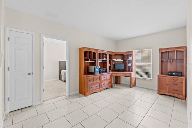 home office featuring light tile patterned floors