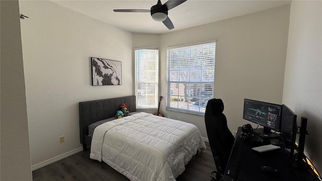 bedroom featuring dark hardwood / wood-style floors and ceiling fan